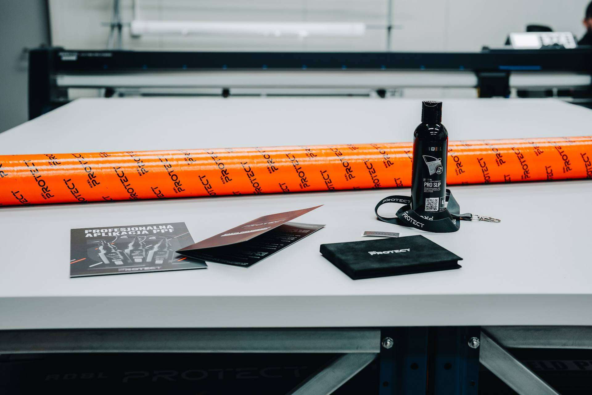 Plotter work table with rolls of ADBL Protect film