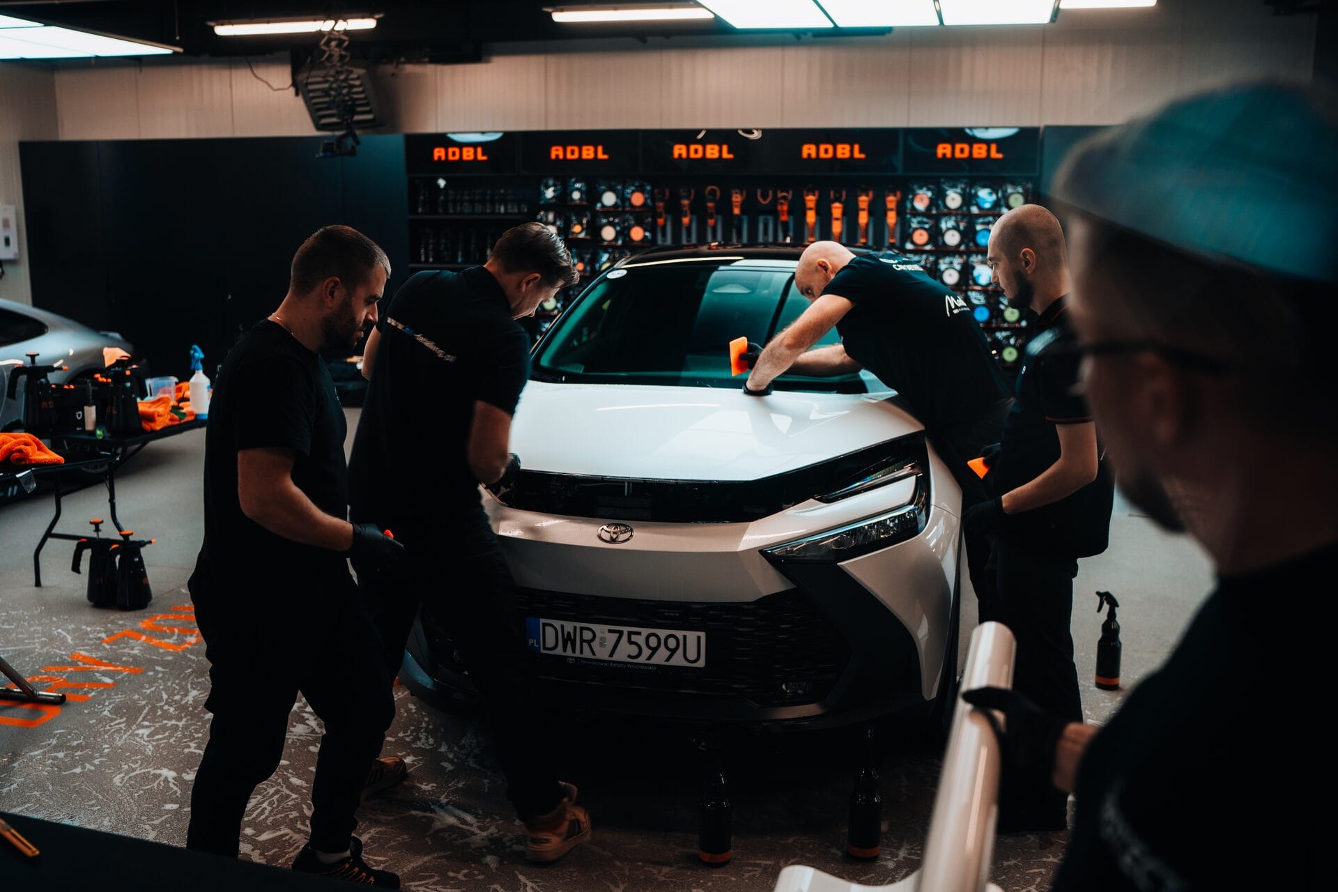Team applying PPF to a car